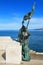 Statue of a soldier with flag at Trieste waterfront, Italy