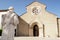 Statue of St. Francis facing Gothic portal of the Convent of Sao Francisco, Santarem, Portugal