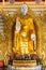 Statue of standing Buddha in the main shrine hall of Dhammikarama Burmese Temple in Georgetown of Penang in Malaysia