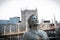 Statue of a strong woman with construction site in the background in Oslo