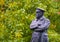 Statue to Commander Edward John Smith on the background of green trees - captain of RMS Titanic