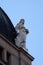 Statue on top of the old city buildings on Ban Jelacic Square in Zagreb