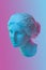 Statue of Venus de Milo. Creative concept colorful neon image with ancient greek sculpture Venus or Aphrodite head