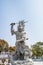 Statue of the Viruá¸haka Heavenly King in front of Golden statue of bodhisattva guanyin Mount Luojia, Zhoushan, Zhejiang, the