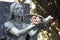 Statue of a woman with a dove in the cemetery of Staglieno in Genoa