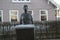 Statue of woman who is carries bricks named ijsselsteentjes named stenenkruister in Nieuwerkerk aan den IJssel in the Netherlands