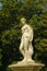 Statue of a young noble man in the gardens of the castle of Chantilly
