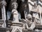 Statues of angel, lion and philosopher at Siena Cathedral