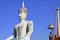 Statues of Budha soaring into blue sky