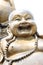 Statues of Chinese deity in smiling.