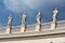 Statues on the colonnades. St. Peter`s Square