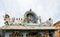 Statues dancing god Shiva and goddess Parvati, Nandi bull and other creatures on a roof of ancient Shiva temple