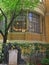 Statues and the exterior of the Drawing room in rotunda architecture with beautiful glass windows and stone columns