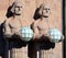 Statues holding the spherical lamps at the Helsinki Central railway station