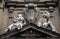 Statues of Hope and Poverty seated either side of the arms of the Theatine order, Santi Michele e Gaetano church in Florence