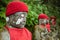 Statues of Ksitigarbha bodhisattva Jizo with red caps and bibs in Nikko, Japan