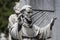 Statues of mourning at the graves of the monumental cemetery in Milan.