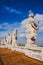 statues on top of St Peters Basilica on blue sky, Vatican