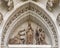 Statues in the Tympanum of the Door of Conception, opening into the Courtyard of Orange Trees in the Seville Cathedral in Spain.