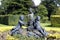 Statues in a yew topiary formal garden in England, Europe