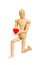 Statuette figure wooden man human makes shows experiences emotional action on a white background. In love with a heart in his hand