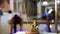 Statuette of ganesha and aroma stick, yoga group of women exercising studio on a blurred background