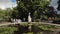 Statuette of a girl in a fountain with water lilies. Seagull on the head of the figurine.