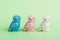 Statuettes of White, Blue and Pink Owls