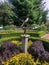 Statute in center of beautiful garden