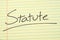 Statute On A Yellow Legal Pad