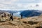 Stavanger, Norway - April 16, 2016: People standing at Preikestolen, the Pulpit Rock. Lysefjorden in the background.