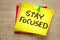 Stay focused reminder on a sticky note