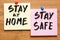 Stay at home and be safe. Self isolation and quarantine campaign to protect yourself and save lives. Handwritten.