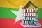 STAY HOME SAVE LIVES text and open laptop against the Myanma flag. Social distancing during COVID-19 outbreak in Myanmar