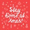 Stay home at xmas, white handwritten lettering on red background