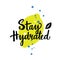 Stay hydrated. Hand lettering with illustration of lemon.