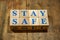 Stay Safe. Wooden cubes with blue letters