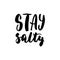 Stay salty - hand drawn lettering quote on the white background. Fun brush ink inscription for photo overlays
