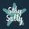 Stay salty with sketch of engraved starfish. Handwritten vintage lettering