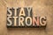 Stay strong word abstract in wood type