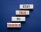 Stay True to Yourself symbol. Wooden blocks with words Stay True to Yourself. Beautiful deep blue background. Business and Stay