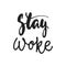 Stay woke - hand drawn lettering phrase isolated on the black background. Fun brush ink vector illustration for banners