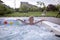 Staycation in summer cottage. Kid having rest in bathtub with bubby water, happy summertime