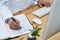 Staying abreast with the latest medical advances. Closeup shot of a doctor using a computer and making notes in an