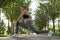 Staying flexible. Full length of beautiful fitness woman in sportswear doing stretching exercises in the city park on a