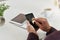 Staying well connected is important when starting a new business. a man using a phone at his desk in an office.