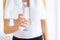 Staying well-hydrated is key. Cropped view of a sporty young woman holding a water bottle.