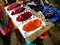 A ste of four color kumkuma powder a religious mark in india is kept for sale in a street shop on Tamil new year festival or