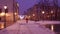 Steadicam shot of Krakow old town street and lonely biker riding in the snow. 4K video