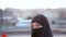 Steadycam - Woman dressed with black headscarf, chador walking, istanbul